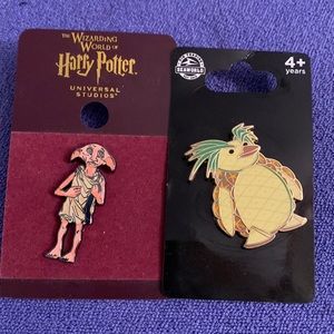 Harry Potter Dobby House Elf pin and Seaworld pineapple penguin pin